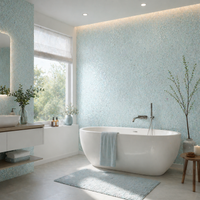 Beispielbild: Elegantes Badezimmer mit freistehender Badewanne und Baumwollputz Sajade Südsee 6 als Wandbelag – nahtlose Flüssigtapete in hellen Blau- und Türkistönen für modernes Raumdesign